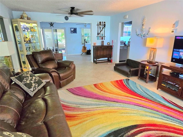 1711 SW 22nd St, Boynton Beach, FL 33426 - living room featuring a ceiling fan and a textured ceiling
