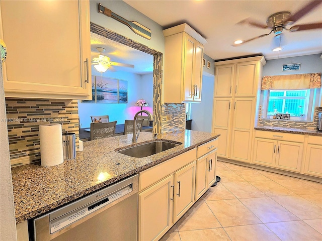 1711 SW 22nd St, Boynton Beach, FL 33426 - kitchen featuring ceiling fan, stainless steel dishwasher, decorative backsplash, light tile patterned floors, and stone counters