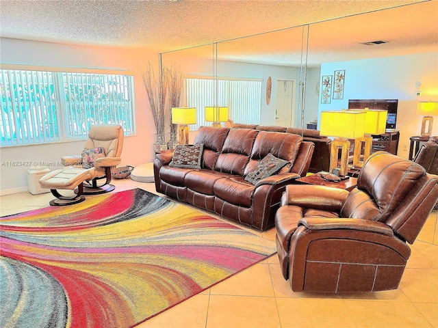 1711 SW 22nd St, Boynton Beach, FL 33426 - living room with tile patterned flooring and a textured ceiling