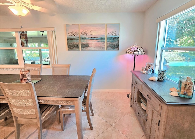 1711 SW 22nd St, Boynton Beach, FL 33426 - dining space featuring a ceiling fan, light tile patterned floors, and a textured ceiling