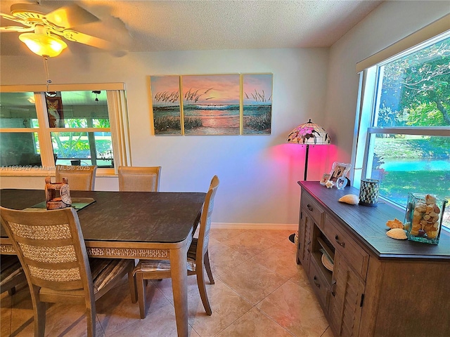 1711 SW 22nd St, Boynton Beach, FL 33426 - dining space with light tile patterned flooring and a textured ceiling