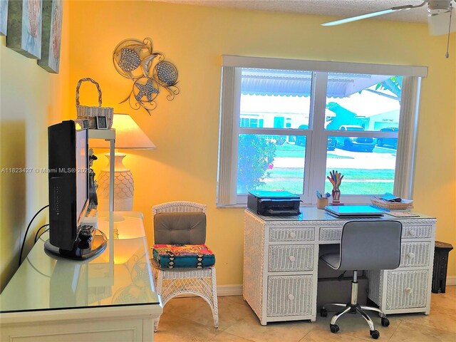 1711 SW 22nd St, Boynton Beach, FL 33426 - tiled home office with ceiling fan and baseboards