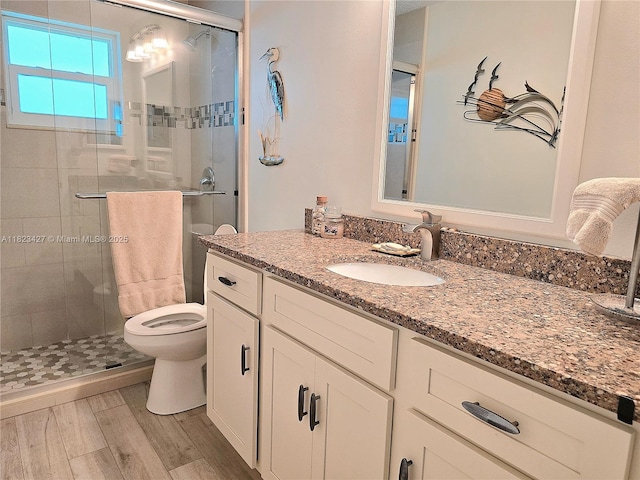 1711 SW 22nd St, Boynton Beach, FL 33426 - full bath featuring vanity, a shower stall, and wood finished floors