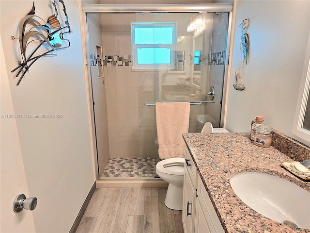 1711 SW 22nd St, Boynton Beach, FL 33426 - full bath with wood finished floors, vanity, and a shower stall