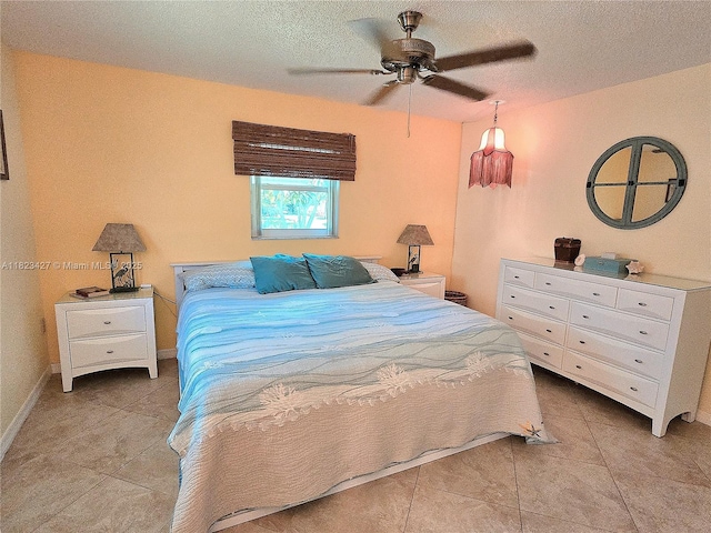 1711 SW 22nd St, Boynton Beach, FL 33426 - tiled bedroom featuring ceiling fan and a textured ceiling