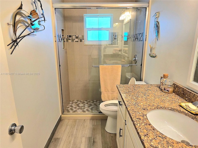 1711 SW 22nd St, Boynton Beach, FL 33426 - full bath featuring wood finished floors, vanity, and a stall shower