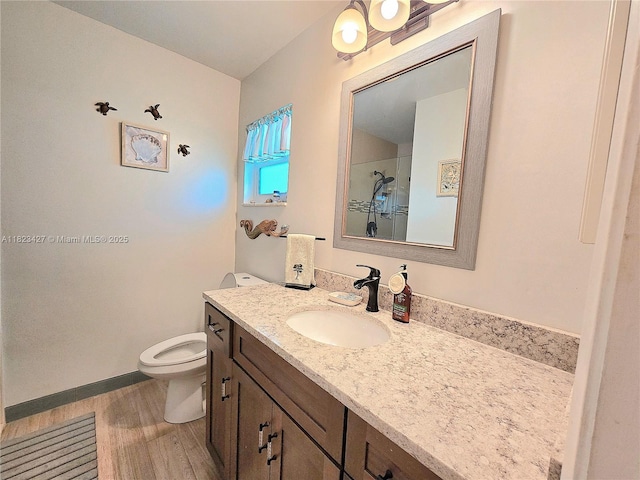 1711 SW 22nd St, Boynton Beach, FL 33426 - bathroom featuring vanity, wood finished floors, and a shower