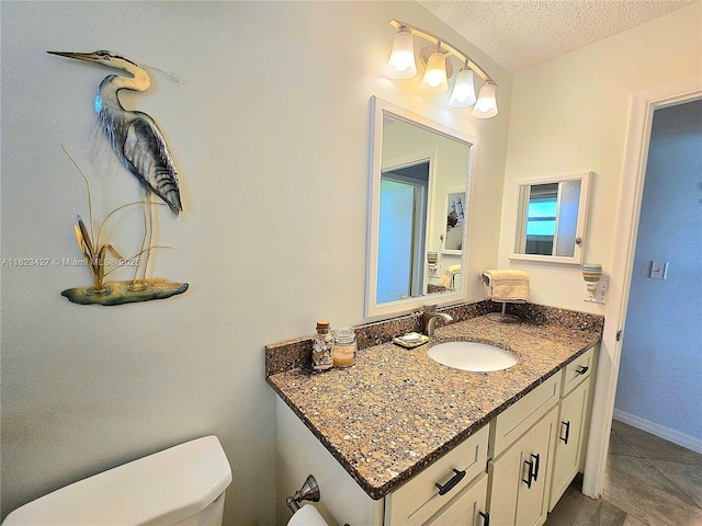 1711 SW 22nd St, Boynton Beach, FL 33426 - bathroom with vanity, a textured ceiling, and tile patterned flooring