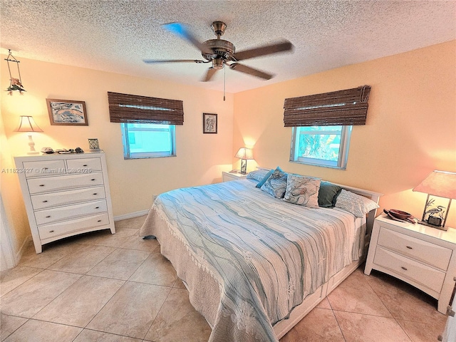 1711 SW 22nd St, Boynton Beach, FL 33426 - bedroom with multiple windows, light tile patterned floors, a textured ceiling, and a ceiling fan