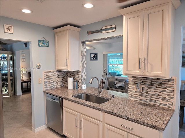 1711 SW 22nd St, Boynton Beach, FL 33426 - kitchen featuring dishwasher, dark stone counters, tasteful backsplash, light tile patterned floors, and recessed lighting