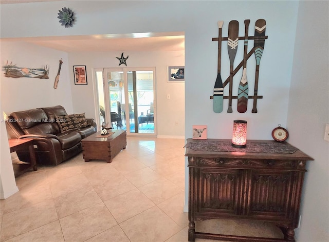 1711 SW 22nd St, Boynton Beach, FL 33426 - living room featuring light tile patterned floors and baseboards
