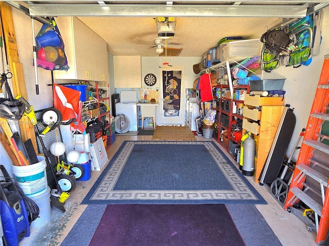 1711 SW 22nd St, Boynton Beach, FL 33426 - garage with a garage door opener and a ceiling fan