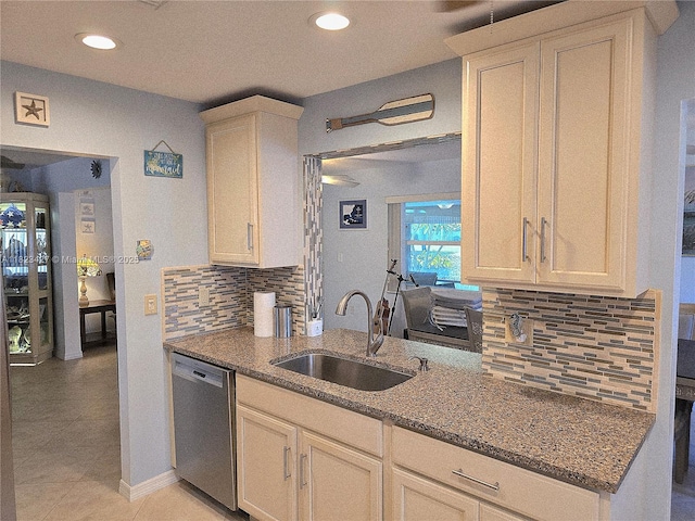 1711 SW 22nd St, Boynton Beach, FL 33426 - kitchen featuring stainless steel dishwasher, dark stone counters, decorative backsplash, recessed lighting, and light tile patterned floors