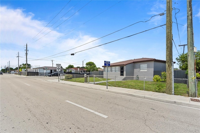 6474 Palm Ave, Hialeah, FL 33012 - view of asphalt road featuring sidewalks, curbs, and a residential view