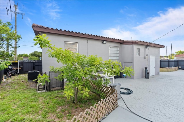 6474 Palm Ave, Hialeah, FL 33012 - view of home's exterior featuring stucco siding and a patio area