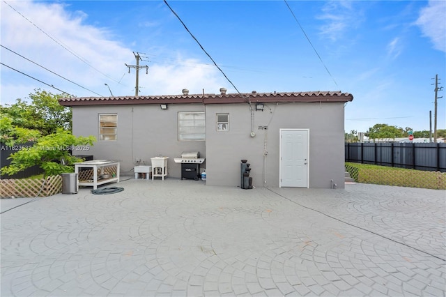 6474 Palm Ave, Hialeah, FL 33012 - back of property with stucco siding and a patio