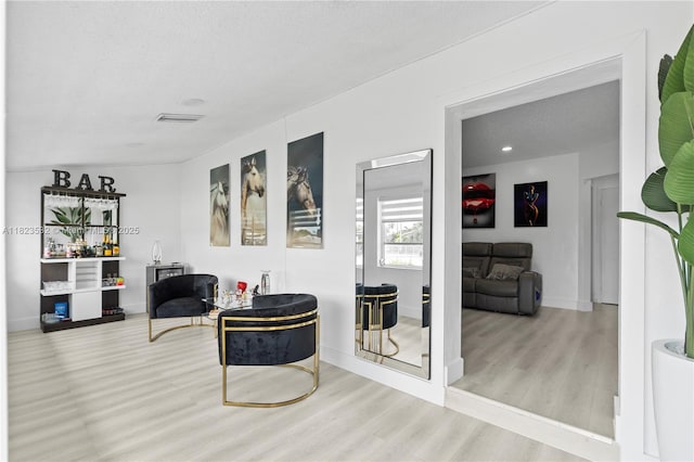 6474 Palm Ave, Hialeah, FL 33012 - living room with wood finished floors and a textured ceiling