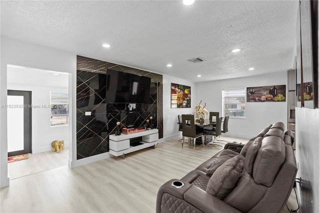 6474 Palm Ave, Hialeah, FL 33012 - living room featuring a textured ceiling, wood finished floors, and recessed lighting