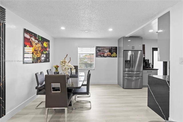 6474 Palm Ave, Hialeah, FL 33012 - dining area featuring a textured ceiling, light wood-type flooring, and recessed lighting