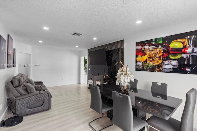 6474 Palm Ave, Hialeah, FL 33012 - dining room with wood finished floors, recessed lighting, and a textured ceiling