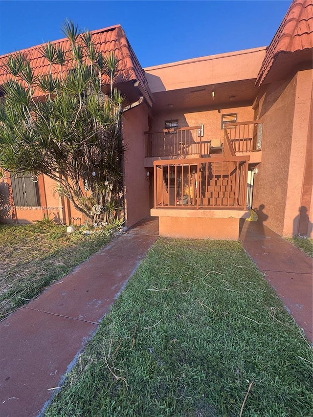 6515 W 27th Ct Unit 49-13, Hialeah, FL 33016 - back of house with stucco siding, a tile roof, and stairway