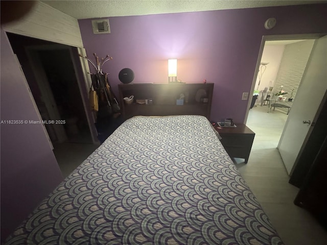 6515 W 27th Ct Unit 49-13, Hialeah, FL 33016 - bedroom featuring a textured ceiling