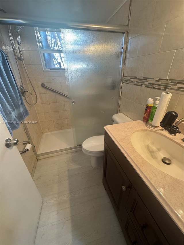 6515 W 27th Ct Unit 49-13, Hialeah, FL 33016 - full bathroom with a shower stall, vanity, and tile walls