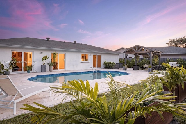 12811 SW 9th Pl, Davie, FL 33325 - pool at dusk with a gazebo and a patio area