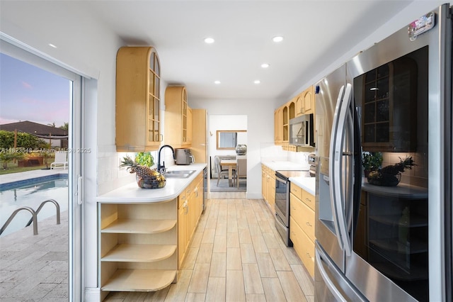 12811 SW 9th Pl, Davie, FL 33325 - kitchen featuring stainless steel appliances, open shelves, light brown cabinets, light countertops, and recessed lighting