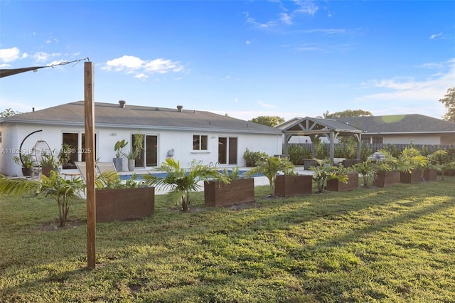 12811 SW 9th Pl, Davie, FL 33325 - back of property featuring a gazebo, a patio area, outdoor lounge area, a lawn, and stucco siding