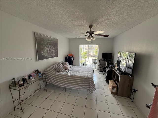 5705 W 20th Ave Unit 310, Hialeah, FL 33012 - bedroom with light tile patterned floors, a textured ceiling, and ceiling fan