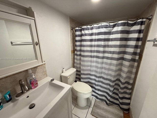 5705 W 20th Ave Unit 310, Hialeah, FL 33012 - full bath featuring backsplash, vanity, a shower with shower curtain, and tile patterned floors