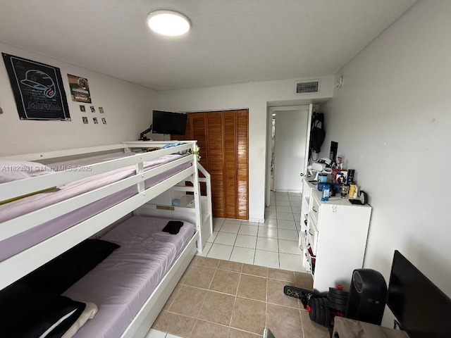 5705 W 20th Ave Unit 310, Hialeah, FL 33012 - bedroom featuring light tile patterned flooring