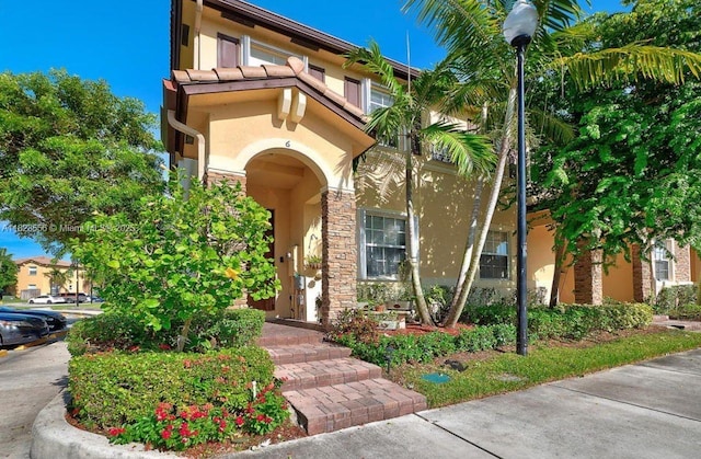 9125 SW 227th St, Cutler Bay, FL 33190 - view of front of home featuring stucco siding and stone siding