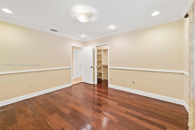 13454 SW 58th Ave, Pinecrest, FL 33156 - unfurnished bedroom featuring wood finished floors, crown molding, a spacious closet, and recessed lighting