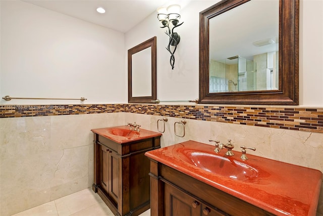 13454 SW 58th Ave, Pinecrest, FL 33156 - full bath featuring tile walls, two vanities, tile patterned flooring, and a wainscoted wall