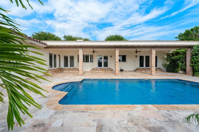13454 SW 58th Ave, Pinecrest, FL 33156 - swimming pool with french doors, a ceiling fan, entry steps, and a patio