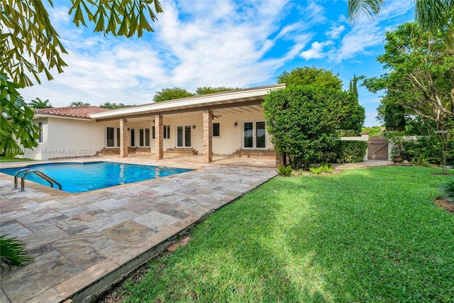 13454 SW 58th Ave, Pinecrest, FL 33156 - swimming pool with a yard, ceiling fan, a gate, a patio, and french doors