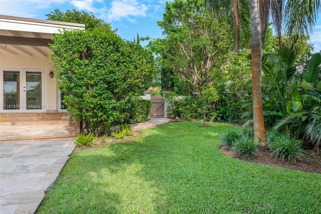13454 SW 58th Ave, Pinecrest, FL 33156 - view of green lawn with a gate and french doors