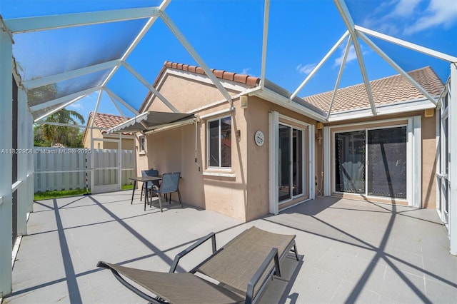 490 Talavera Rd, Weston, FL 33326 - rear view of property with a patio, a tile roof, stucco siding, and a lanai