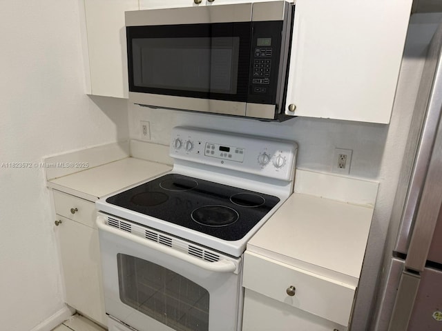 15422 SW 284th St Unit 7207, Homestead, FL 33033 - kitchen featuring appliances with stainless steel finishes, white cabinets, and light countertops
