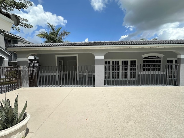 15422 SW 284th St Unit 7207, Homestead, FL 33033 - exterior space with stucco siding and a tiled roof