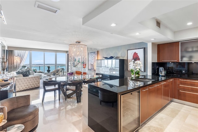 1331 Brickell Bay Dr Unit 2305, Miami, FL 33131 - kitchen with open floor plan, wine cooler, dark stone countertops, modern cabinets, and recessed lighting