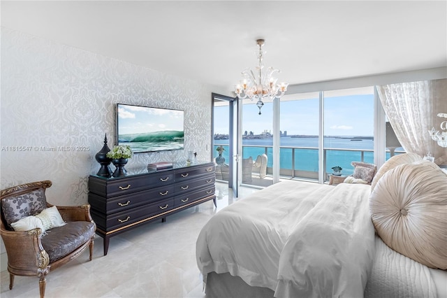 1331 Brickell Bay Dr Unit 2305, Miami, FL 33131 - bedroom with access to outside, a chandelier, a water view, light tile patterned floors, and wallpapered walls