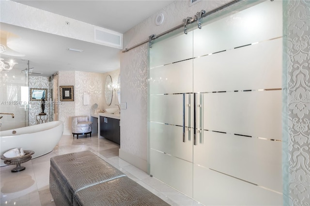 1331 Brickell Bay Dr Unit 2305, Miami, FL 33131 - bathroom with a freestanding tub, vanity, tile patterned flooring, and a walk in shower