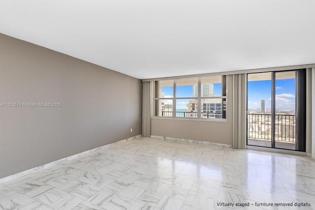 2101 S Ocean Dr Unit 2707, Hollywood, FL 33019 - unfurnished room featuring baseboards and marble finish floors