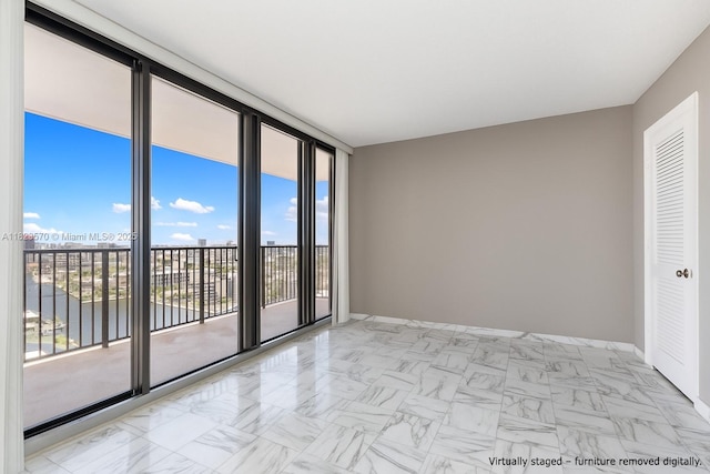 2101 S Ocean Dr Unit 2707, Hollywood, FL 33019 - spare room with a water view, marble finish flooring, and expansive windows