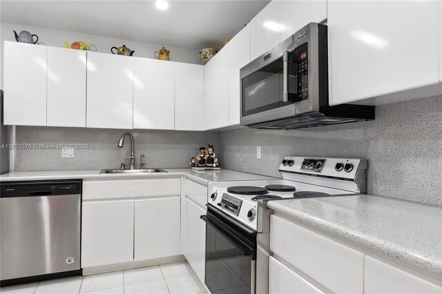 2101 S Ocean Dr Unit 2707, Hollywood, FL 33019 - kitchen featuring appliances with stainless steel finishes, backsplash, and white cabinets
