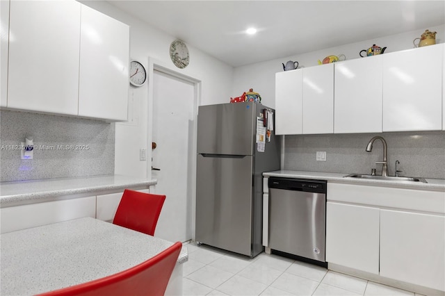 2101 S Ocean Dr Unit 2707, Hollywood, FL 33019 - kitchen featuring stainless steel appliances, backsplash, light countertops, and white cabinets