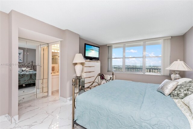 2101 S Ocean Dr Unit 2707, Hollywood, FL 33019 - bedroom featuring marble tiled flooring and connected bathroom